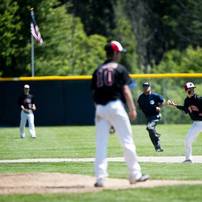 Milan junior Kyle Schrader throws to first for an out in the game against Richmond on Friday, June 14. Daniel Brenner I AnnArbor.com